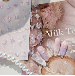 Detailed laser nail stickers with butterfly and lace patterns on pink gradient nails