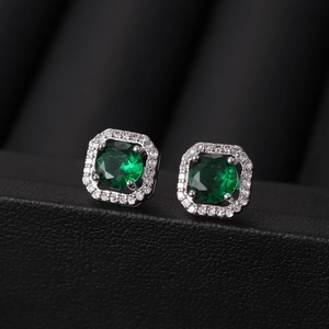 Elegant square halo stud earrings with deep green gemstones in polished silver finish