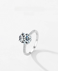 Macro shot of S925 sterling silver ring showing the oval-cut zircon and inner hallmark