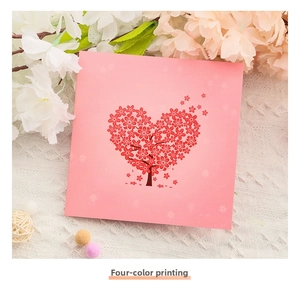 Detailed view of pink greeting card featuring a 3D heart-shaped cherry blossom tree design