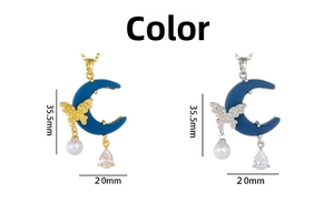 Detail view of butterfly moon pendant necklace measuring 35.5mm by 20mm in blue and gold