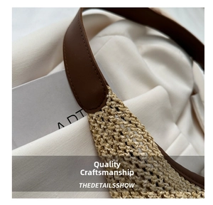 Detail showing high-quality straw weave texture and brown leather strap stitching