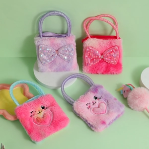 Detail of colorful plush rabbit purses with sequin bows and cute embroidered faces