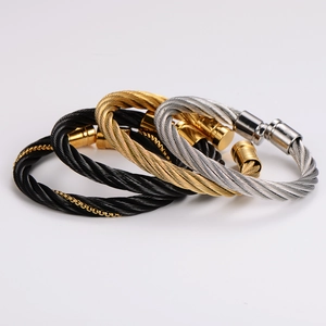 Three-color twisted stainless steel cable bangles in gold, silver, and black finish