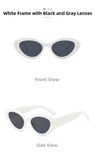 Detail view of oval white cat-eye sunglasses with yellow star studs and dark grey lenses