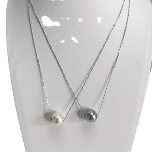 Elegant S925 silver necklace with high-luster round pearl pendant on white mannequin