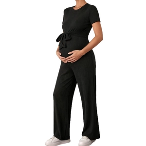Elegant black ribbed knit maternity jumpsuit with short sleeves and a waist tie detail