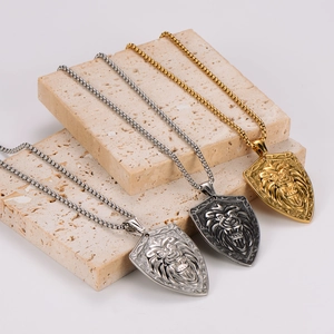 Set of three stainless steel lion head shield necklaces in gold, silver, and vintage grey finish