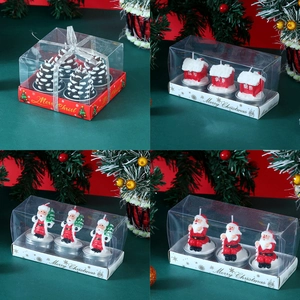 Macro shot of 4-piece Christmas candle gift set with Santa and pinecone shapes