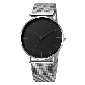 Minimalist quartz watch with matte black dial and silver mesh steel band on white background