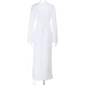 Elegant white long sleeve dress featuring a sexy backless V-neck and stylish ring detail