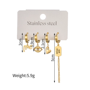 Golden stainless steel asymmetric earrings set with engraved square charms and crystals