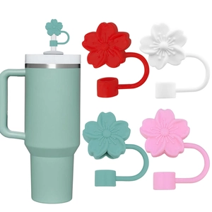 Detail of multi-color silicone cherry blossom straw covers on a 40oz insulated tumbler