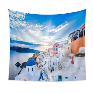 Close-up of Santorini sunset wall tapestry fabric with blue dome church and white houses