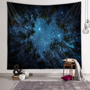 Detail of forest starry sky tapestry showing dense canopy and galaxy on a brick wall