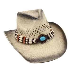 Detail view of woven straw cowboy hat featuring wooden beads and turquoise centerpiece