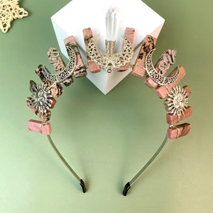 Bohemian crown with pink stones, moon, sun, and snake charms on a gold wire headband