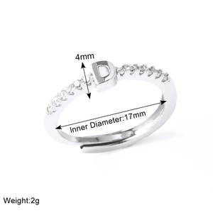 Detailed view of silver letter D ring with crystal inlay and technical measurements