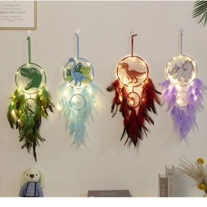 Detail of colorful dinosaur and unicorn dream catchers with LED lights and feathers