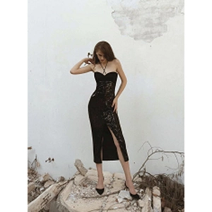 Elegant black sequin halter neck maxi dress with high slit and slim fit evening style