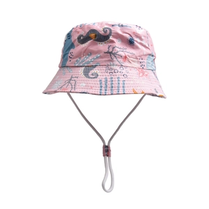 Detail of pink kids bucket hat with seahorse marine print and adjustable windproof strap