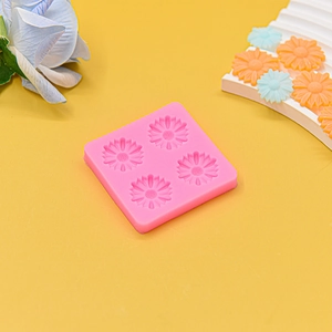 Detailed macro view of 4-hole daisy flower silicone mold for chocolate and fondant DIY