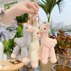 Three plush alpaca keychains in pink, white, and gray with sturdy metal lobster clasps