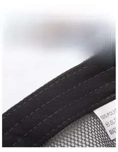Macro shot of breathable mesh fabric and moisture-wicking sweatband on black sports cap