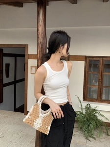 Detail of handcrafted crochet tote bag with brown and beige geometric diamond knit patterns