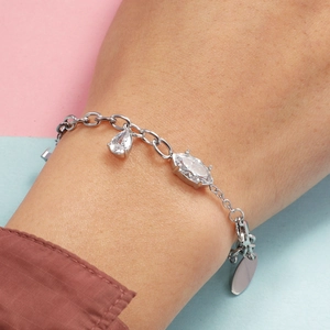 Detail of silver heart bracelet featuring pear and marquise-cut cubic zirconia stones