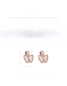 Detail view of gold butterfly earrings with white pearls and zircons weighing 7.4g
