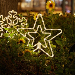 Solar powered star and snowflake garden stake lights with warm white LED for outdoor decor