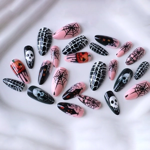 Halloween pink and black long almond press-on nails with pumpkin and skull art