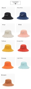 Nine color options of cotton canvas bucket hats with frayed edges and letter patches