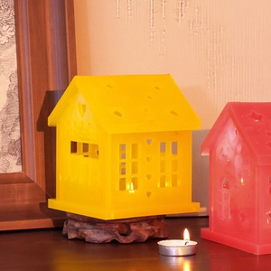 DIY Christmas house resin mold featuring heart and star cutouts with wooden base