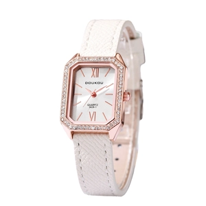 Elegant rose gold tonneau watch with rhinestone bezel and white leather strap on white background
