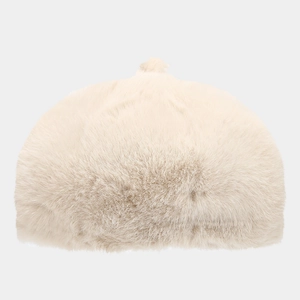 Close-up of soft plush texture and warm beige faux fur material on winter beret hat