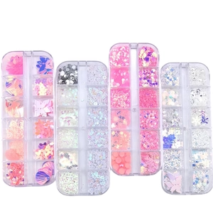 Mix of butterfly, star, and heart nail art sequins in clear 12-grid organizer cases