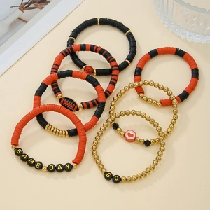 Detail of multi-layered sports bracelet set with GAME DAY letter beads and clay discs