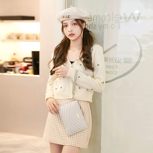 Quilted light gray envelope clutch with gold metal plate and stylish leather wristlet
