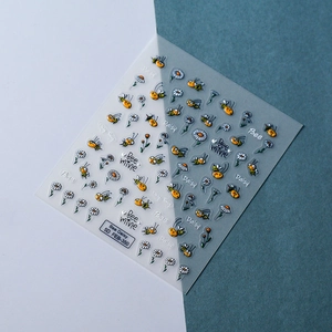 Macro detail of 5D embossed nail stickers featuring yellow bees and white daisies