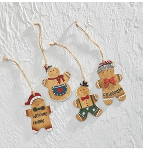 Set of four hand-painted wooden gingerbread man ornaments with festive Christmas accessories