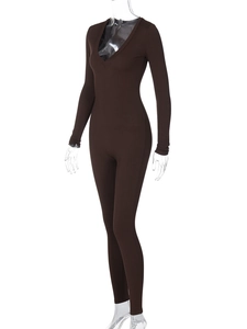 Close-up of dark brown ribbed knit fabric on a slim-fit long sleeve jumpsuit
