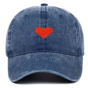 Detail of red pixel heart embroidery on vintage navy washed denim baseball cap