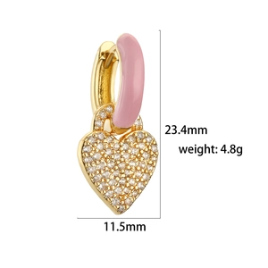 Detail view of pink enamel and heart zircon drop earrings with size measurements
