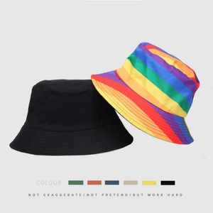 Reversible bucket hat set with classic black and vibrant rainbow stripes in cotton canvas