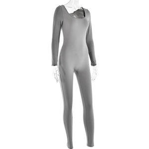 Detail view of a grey long-sleeved bodysuit with high-stretch fabric and a U-neck design