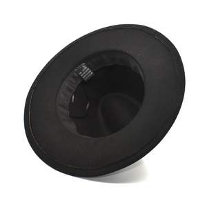 Detail view of black fedora inner lining with 65% cotton and 35% polyester fabric tag