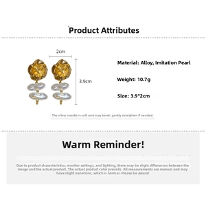 Detail view of golden flower earrings with baroque pearls showing 3.9x2cm dimensions