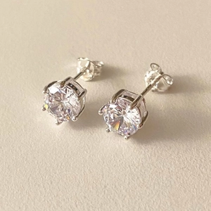Elegant 925 sterling silver six-prong cubic zirconia stud earrings in a minimalist style